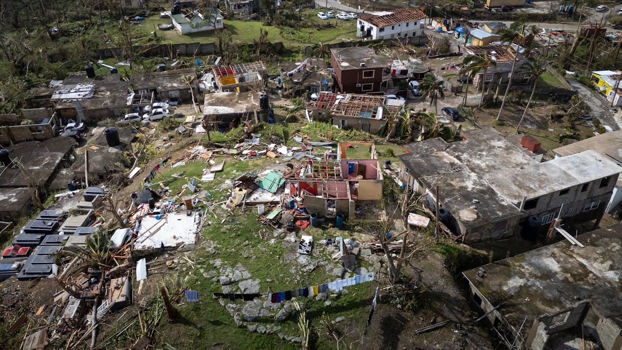 Aerial photo showing extensive hurricane damage in a residential area.